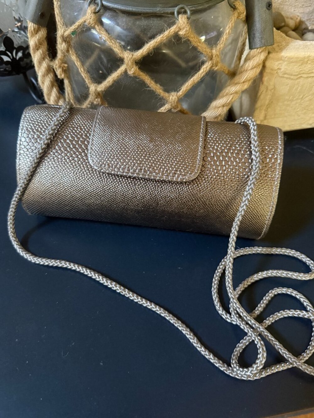 Taupe snakeskin texture clutch with shoulder strap, magnetic snap, no brand